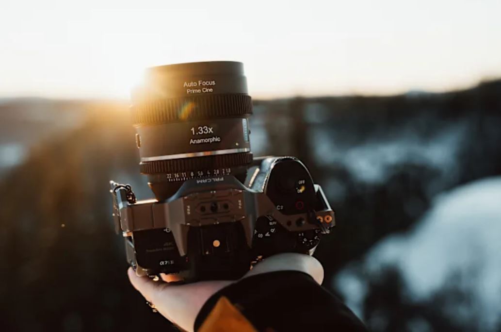 Sirui 20mm anamorphic lens mounted on a camera.