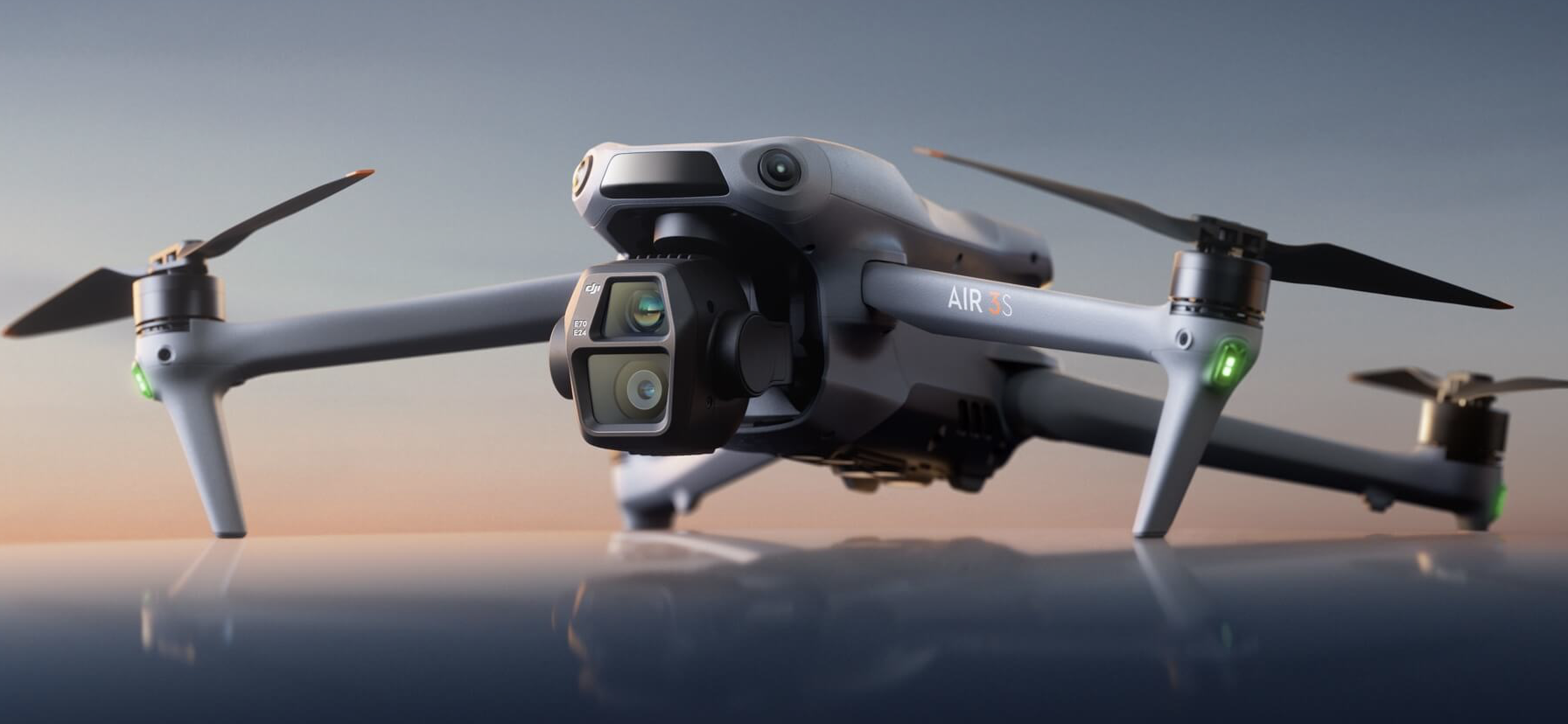 A DJI drone against a sunset