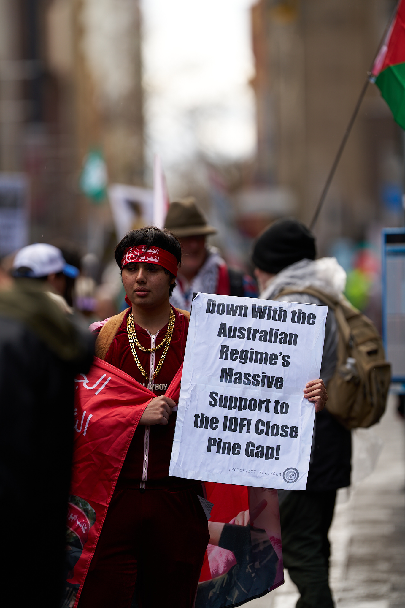A protester holds up sign in a Sydney rally. 