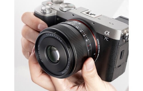 A person holding the Sony Alpha a7