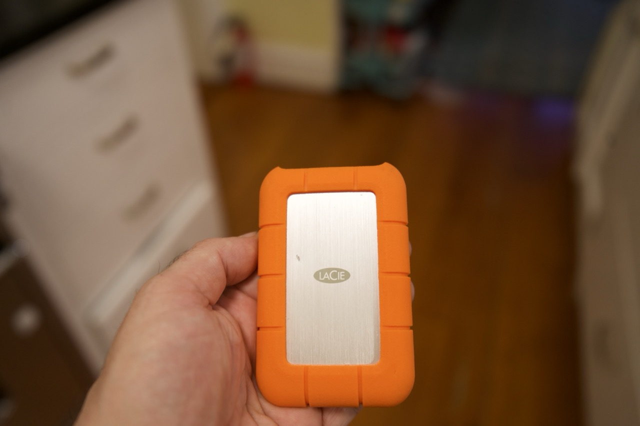 The LaCie Rugged SSD4 in a person's hand