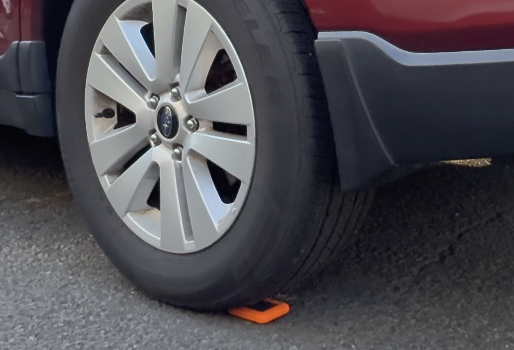 LaCie Rugged4 under the wheel of a red car