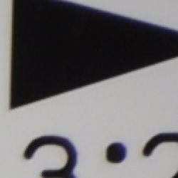 Tele: Very low and dull, top right @200 percent, in-camera JPEG