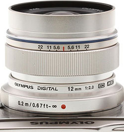 The focus ring on the new 12mm lens slides back to reveal a distance scale, slipping