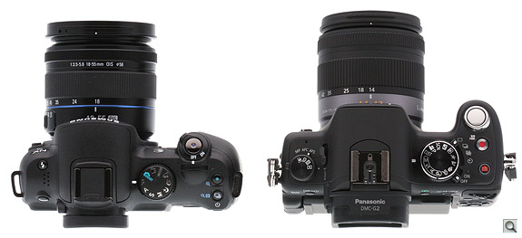 The Samsung NX10's grip is wider and allows a narrower profile front to back.