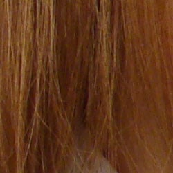 Subtle detail: Hair Moderate noise suppression blurs detail in areas of subtle contrast, as in the