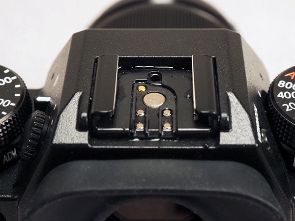 Canon EOS R Review -- extreme close-up of memory card compartment door hinge.