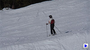 Following a skier as I ride down a lift. Note the wind noise, low exposure, and